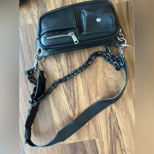 Black vegan leather moto bag worn once. Perfect condition.